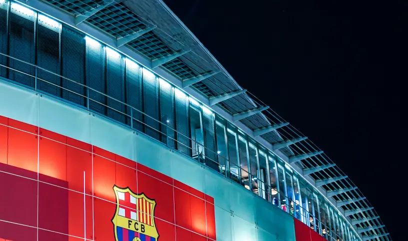 Photo by <a href="https://unsplash.com/@fikrirasyid?utm_content=creditCopyText&utm_medium=referral&utm_source=unsplash">Fikri Rasyid</a> on <a href="https://unsplash.com/photos/fc-barcelona-stadium-at-night-b84nM5W-AF0?utm_content=creditCopyText&utm_medium=referral&utm_source=unsplash">Unsplash</a>;