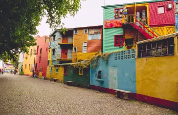 Photo by <a href="https://unsplash.com/@gustavo0351?utm_content=creditCopyText&utm_medium=referral&utm_source=unsplash">Gustavo Sánchez</a> on <a href="https://unsplash.com/photos/a-row-of-multicolored-buildings-on-a-cobblestone-street-j1Yx11T0UI0?utm_content=creditCopyText&utm_medium=referral&utm_source=unsplash">Unsplash</a>;