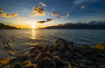 Photo by <a href="https://unsplash.com/@vitor_camilo?utm_source=unsplash&utm_medium=referral&utm_content=creditCopyText">vitor camilo</a> on <a href="https://unsplash.com/photos/the-sun-is-setting-over-a-body-of-water-o2trTCHM8YM?utm_source=unsplash&utm_medium=referral&utm_content=creditCopyText">Unsplash</a>;