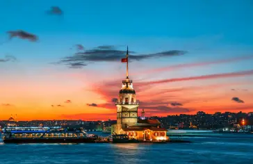 Photo by <a href="https://unsplash.com/@ibuzn?utm_source=unsplash&utm_medium=referral&utm_content=creditCopyText">Ibrahim Uzun</a> on <a href="https://unsplash.com/photos/a-large-building-with-a-flag-on-top-of-it-next-to-a-body-of-water-9FkQpB2rVjw?utm_source=unsplash&utm_medium=referral&utm_content=creditCopyText">Unsplash</a>;